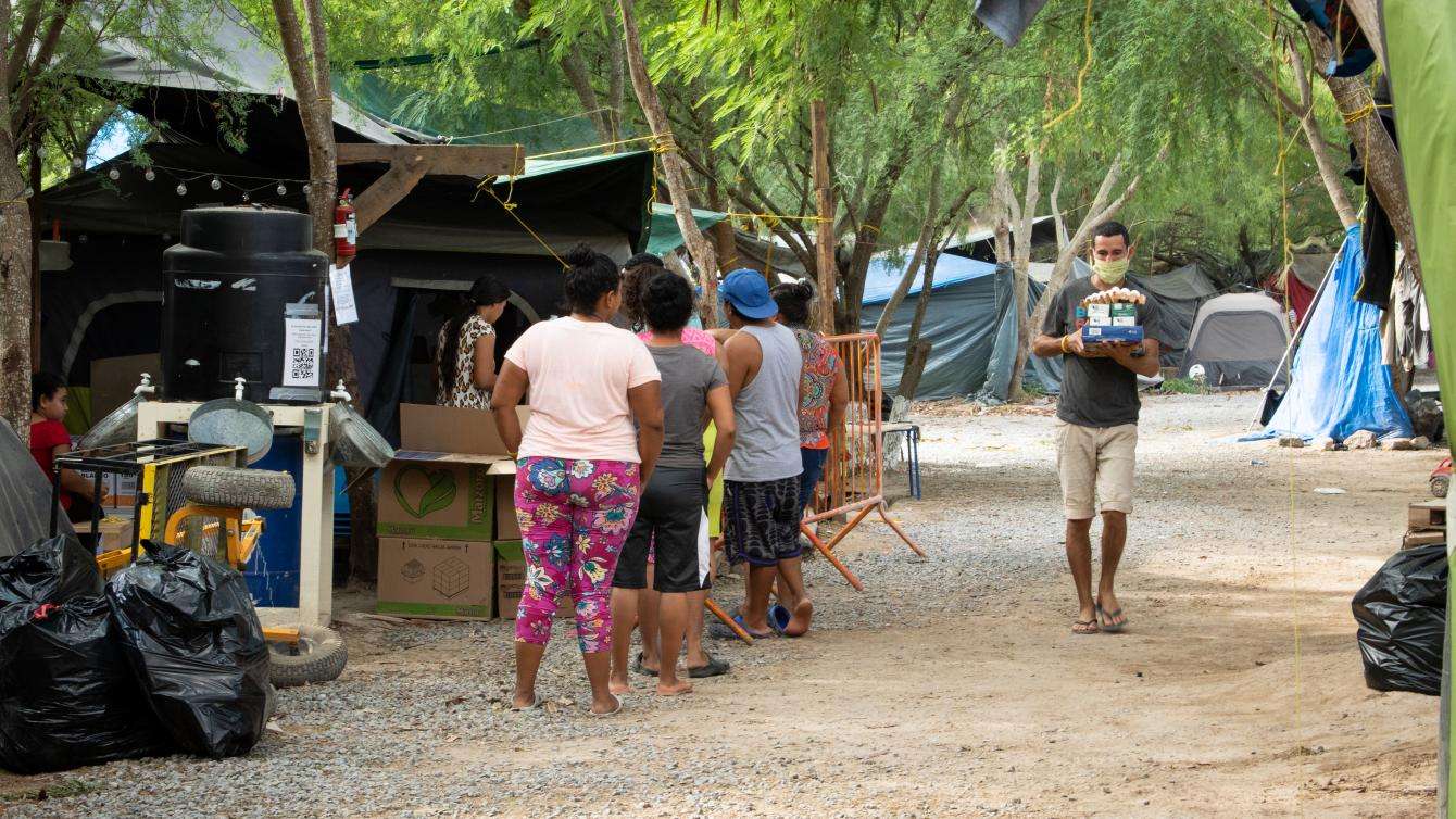 Asylum seekers collect cleaning products, such as bleach, disinfectant, and detergent, once a week to clean the areas where they live and try to prevent the spread of COVID-19.