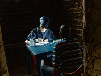 Dr Tathy, an MSF doctor, sees patients considered as non-Ebola suspects in consultation, as part of the mobile intervention clinic and training of local medical staff in the Ebola context, in the village of Bobua. 