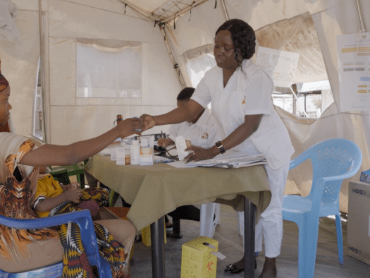 A doctor consults with a patient in Mozambique. 