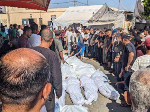 Dead bodies in body bags near Al-Aqsa Hospital in Gaza.