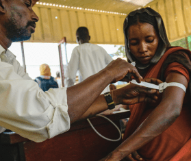 A Sudanese woman is screened for malnutrition in South Darfur.